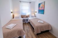 Posteľ alebo postele v izbe v ubytovaní PINNA RESIDENCE - Supin