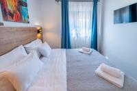 Posteľ alebo postele v izbe v ubytovaní PINNA RESIDENCE - Supin