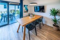 Televízia a/alebo spoločenská miestnosť v ubytovaní PINNA RESIDENCE - Supin