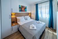 Posteľ alebo postele v izbe v ubytovaní PINNA RESIDENCE - Supin