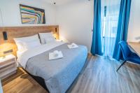 Posteľ alebo postele v izbe v ubytovaní PINNA RESIDENCE - Supin