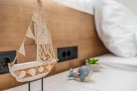 Posteľ alebo postele v izbe v ubytovaní PINNA RESIDENCE - Supin