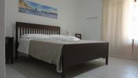 Posteľ alebo postele v izbe v ubytovaní Holiday Home Tarinuzza