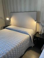 Łóżko lub łóżka w pokoju w obiekcie Hotel Vera