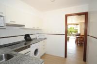 Kuchyň nebo kuchyňský kout v ubytování Orange Park Apartamento Jardin