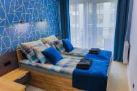 Posteľ alebo postele v izbe v ubytovaní APARTAMENT ELEGANCE BLUE w Let's Sea Basen&SPA