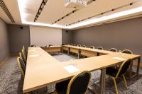 a conference room with tables and chairs and a whiteboard at Radisson Hotel Istanbul Harbiye in Istanbul