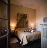 Krevet ili kreveti u jedinici u objektu H&ocirc;tel Les Orangeries