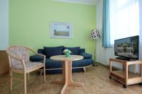 TV a/nebo společenská místnost v ubytování Villa Hans by Rujana