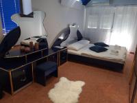 Posteľ alebo postele v izbe v ubytovaní Hotel Garny Pleso