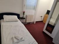 Posteľ alebo postele v izbe v ubytovaní Hotel Garny Pleso