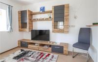Telewizja i/lub zestaw kina domowego w obiekcie Ferienhaus In Schlierbach