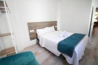 Postel nebo postele na pokoji v ubytování GLORIA SUITES
