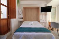 Postel nebo postele na pokoji v ubytování GLORIA SUITES