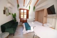 Postel nebo postele na pokoji v ubytování GLORIA SUITES