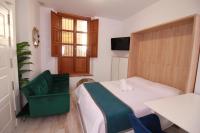 Postel nebo postele na pokoji v ubytování GLORIA SUITES