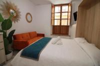 Postel nebo postele na pokoji v ubytování GLORIA SUITES