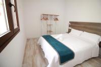 Postel nebo postele na pokoji v ubytování GLORIA SUITES