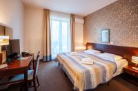 Posteľ alebo postele v izbe v ubytovaní Hotel Kuracyjny Spa & Wellness
