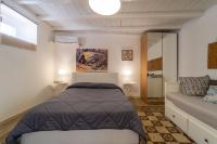 Posteľ alebo postele v izbe v ubytovaní Casa Talete Cozy Apartment in Ortigia - FIRST FLOOR