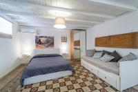 Posteľ alebo postele v izbe v ubytovaní Casa Talete Cozy Apartment in Ortigia - FIRST FLOOR