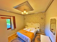 Postel nebo postele na pokoji v ubytování Kuzey Suite Otel