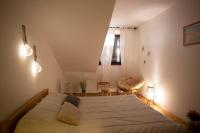 Posteľ alebo postele v izbe v ubytovaní Apartment Kika