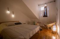 Posteľ alebo postele v izbe v ubytovaní Apartment Kika