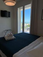 Posteľ alebo postele v izbe v ubytovaní Hotel Riva e Mare