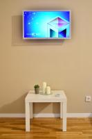 Telewizja i/lub zestaw kina domowego w obiekcie Apartments Downtown
