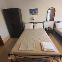 A bed or beds in a room at Villa Giannis 2