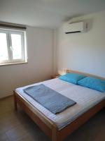 Posteľ alebo postele v izbe v ubytovaní Holiday Home Grimalda