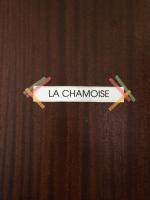 a sign that says la chharmolate on a wooden table at Appartement cosy au pied du MtBlanc in Chamonix