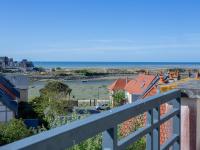 a view of the ocean from a balcony at Apartment Port Guillaume-6 by Interhome in Cabourg