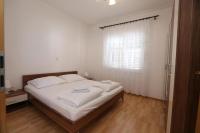 Postel nebo postele na pokoji v ubytování Apartment Davorka