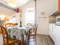 a kitchen and dining room with a table and chairs at Apartment Berasteguia-5 by Interhome in Ciboure