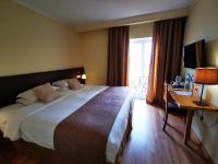 Uma cama ou camas num quarto em Hotel Da Montanha