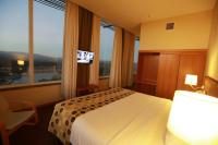 Uma cama ou camas num quarto em Hotel Da Montanha