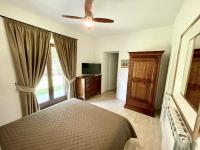 A bed or beds in a room at Villa Podere Del Grasso