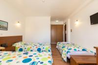 Postel nebo postele na pokoji v ubytování Hotel Azul Praia