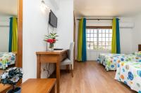 Postel nebo postele na pokoji v ubytování Hotel Azul Praia