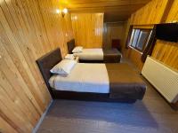 A bed or beds in a room at Ozkan Otel