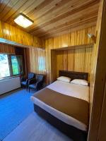 A bed or beds in a room at Ozkan Otel