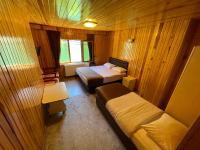 A bed or beds in a room at Ozkan Otel