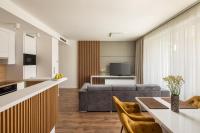 Televízia a/alebo spoločenská miestnosť v ubytovaní Spa Residence Carbona Onyx Deluxe Apartman