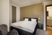 Posteľ alebo postele v izbe v ubytovaní Spa Residence Carbona Onyx Deluxe Apartman
