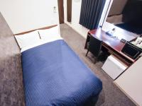 HOTEL LiVEMAX 姫路市役所前にあるベッド