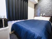 HOTEL LiVEMAX 姫路市役所前にあるベッド