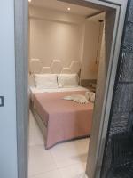 Posteľ alebo postele v izbe v ubytovaní Amalia Deluxe Villas
