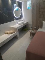 Posteľ alebo postele v izbe v ubytovaní Amalia Deluxe Villas